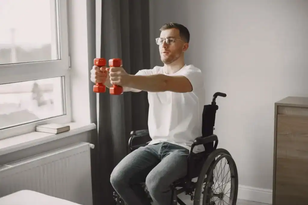 Image of man doing exercise in his wheelchair to aid weight loss Ascot