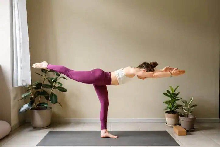Woman doing Yoga exercise Ascot to help with toning the body. 