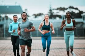 Sculpting Sleek Arms: The Essential Role of Cardio in Toning Without Bulking Up 3 image of people running to incorporate cardio Ascot exercise into their life to help tone arms and body.